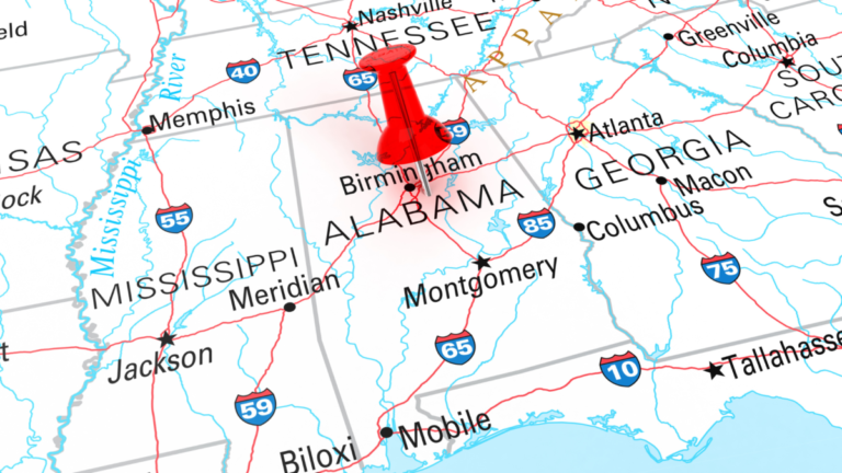 A map of the Southern United states with a red push pin in the state of Alabama