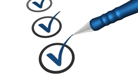 An image of a pen checking a check-list