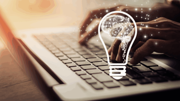 An image of someone typing on a laptop keyboard with a drawing of a brain inside a lightbulb superimposed over it
