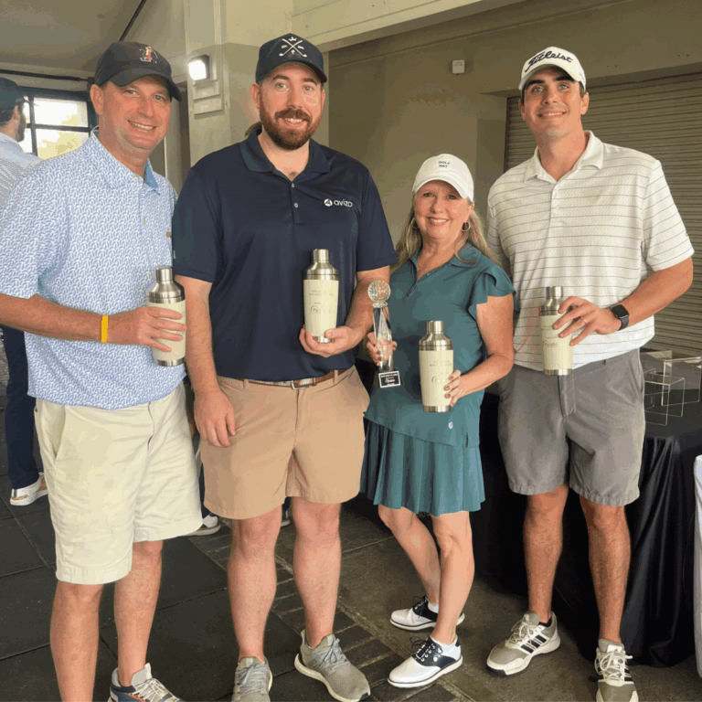 Four members of Avizo's golf team holding winner's trophies.