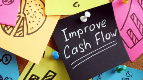 An image of brightly colored sticky notes with a black one that says "Improve cash flow"