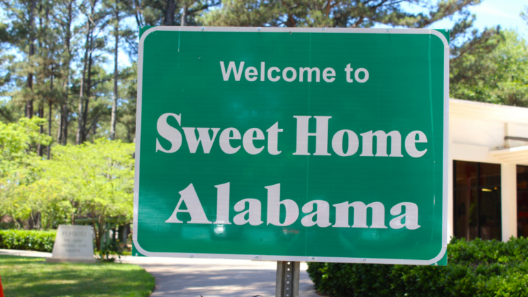 A road sign that says "Sweet Home Alabama"