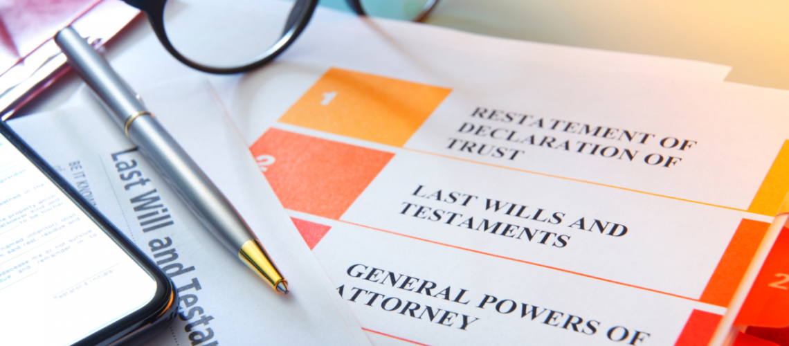 A desktop close up of trust documents with a pen and glasses on the table