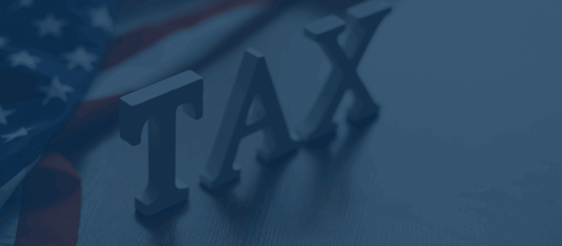 The word "Tax" with flag behind it and a blue overlay