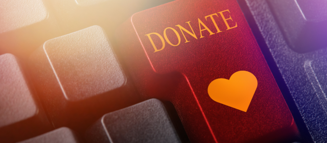 An image of a button that says "donate" with a heart on it.