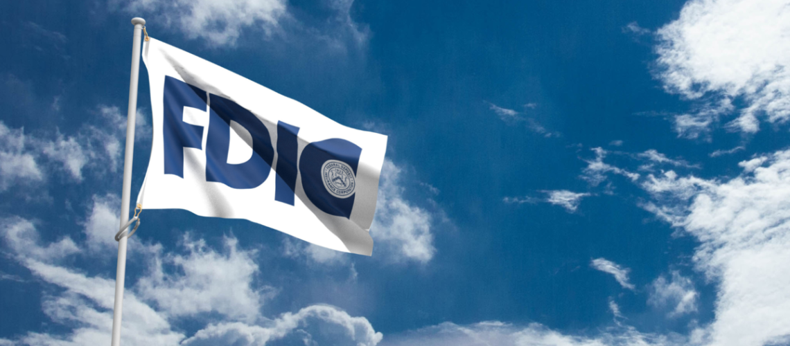 A white flag with the blue FDIC logo on it in a sky with clouds.