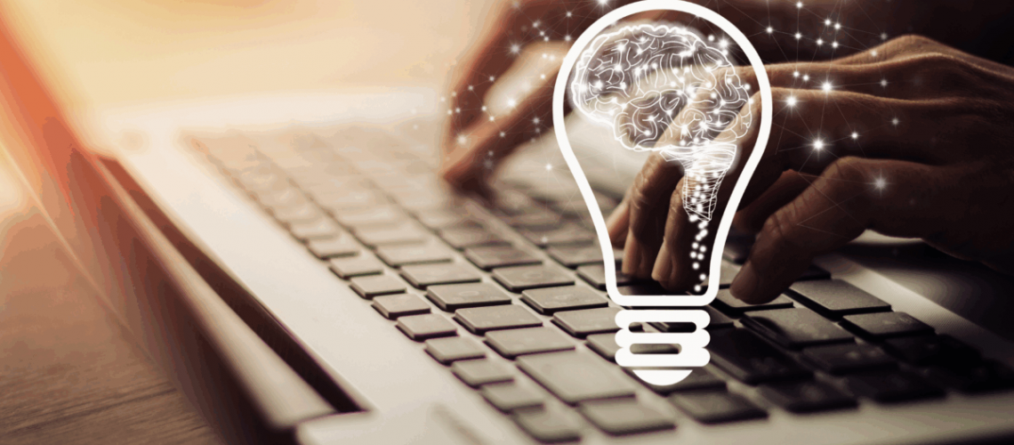 An image of someone typing on a laptop keyboard with a drawing of a brain inside a lightbulb superimposed over it