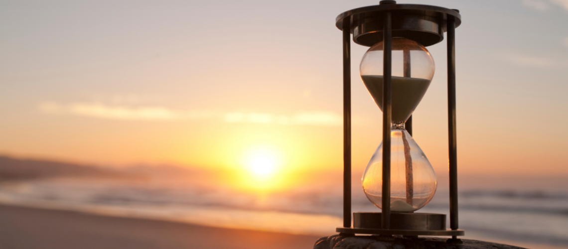 Hourglass on beach