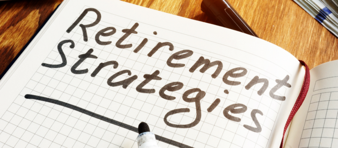 A notebook lying open on a desk, showing one page that has the words "Retirement Strategies" written in black marker