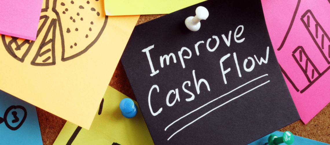 An image of brightly colored sticky notes with a black one that says "Improve cash flow"