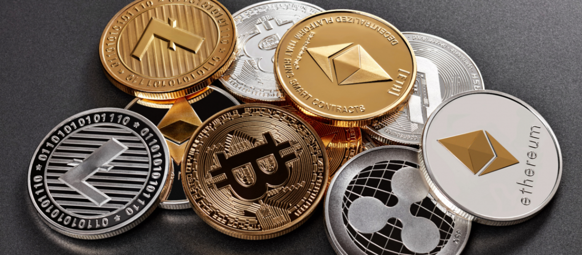 a pile of coins with various cryptocurrency logos engraved into them